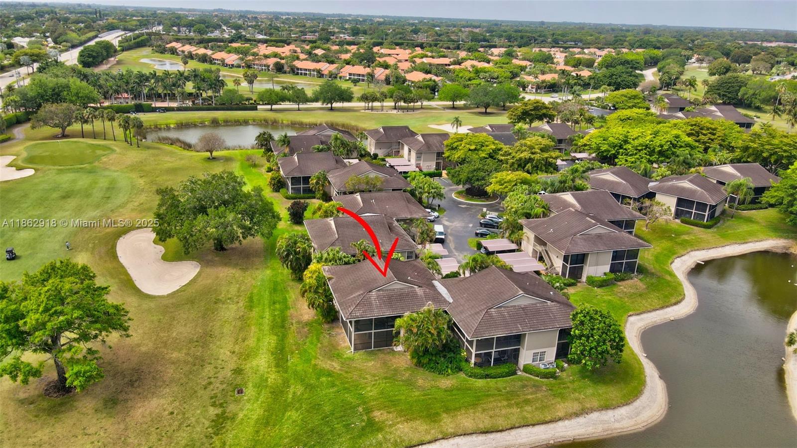 7616 Elm Ridge Drive, Unit 7U Boca Raton, FL 33433 - Photo 32 of 36 an aerial view of residential house with outdoor space and lake view