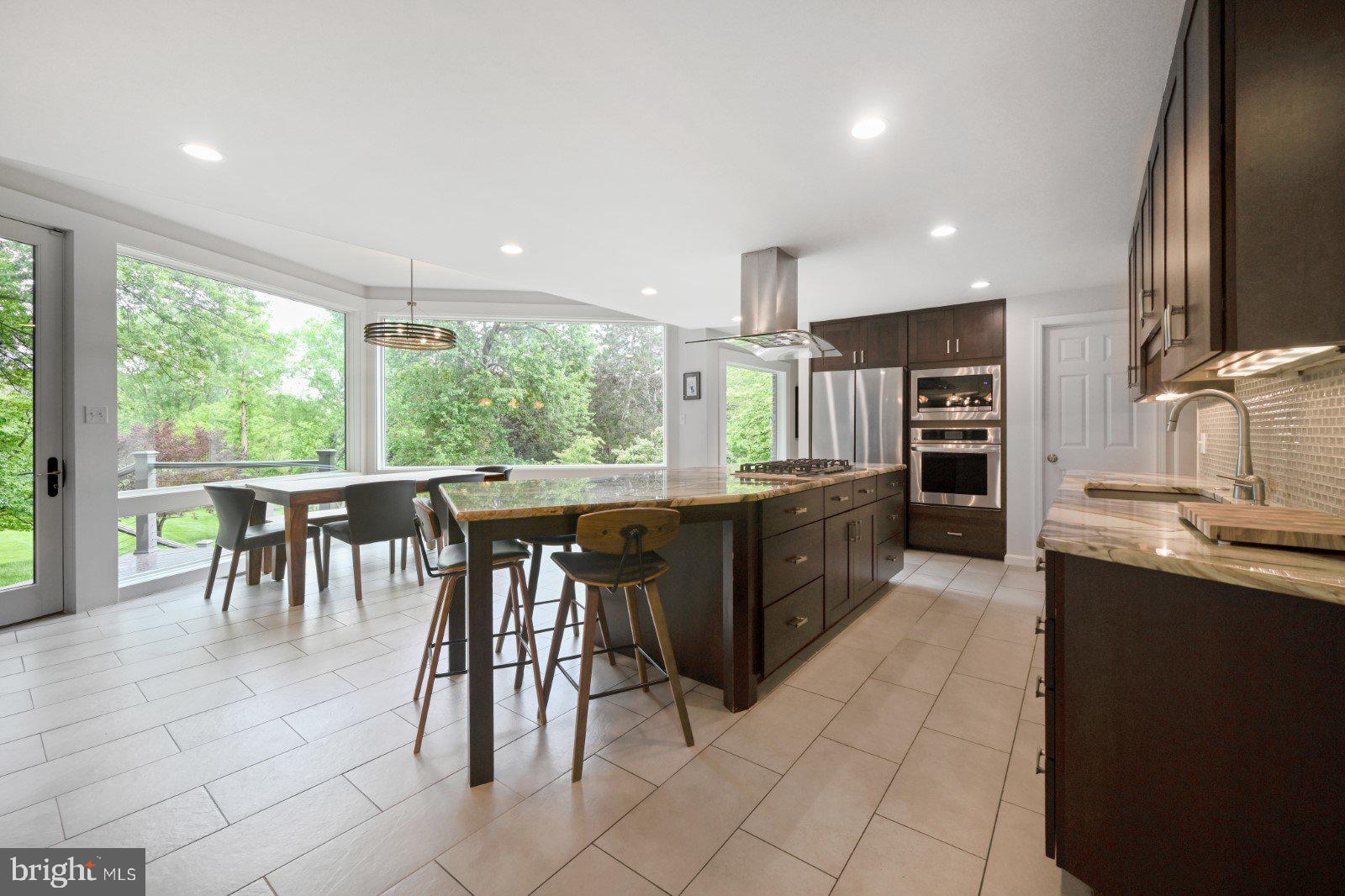 8811 Jones Mill Road Chevy Chase, MD 20815 - Photo 9 of 44 Kitchen with island seating and breakfast area