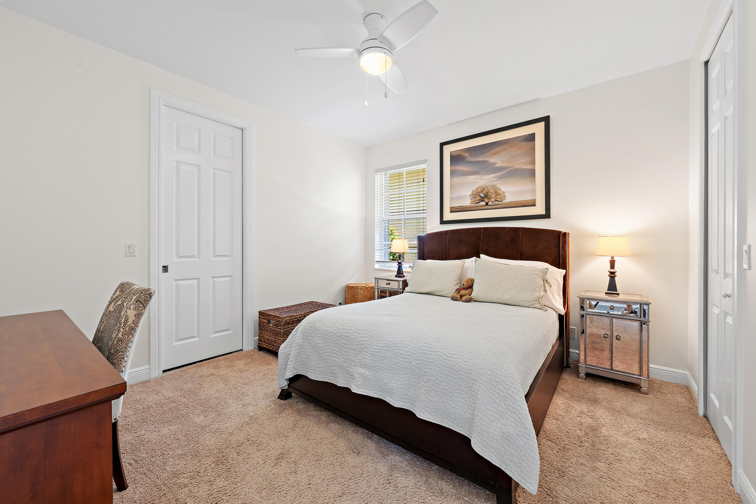 105 Segovia Way Jupiter, FL 33458 - Photo 17 of 33 a bedroom with a bed and lamp