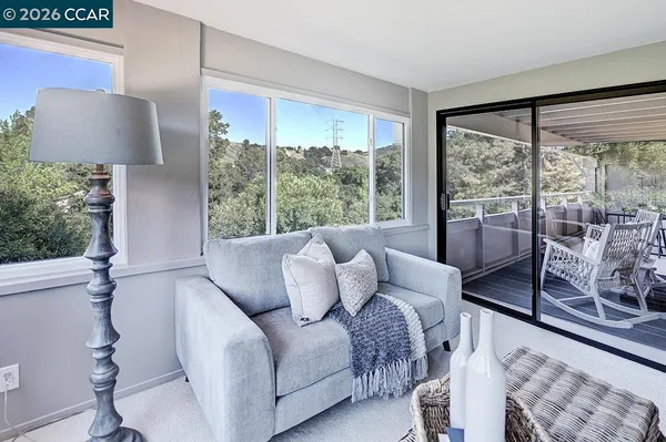 a living room with furniture and a large window