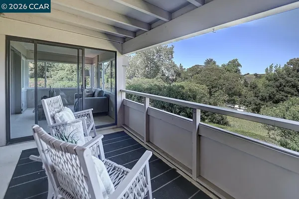 a view of a two chair in the balcony