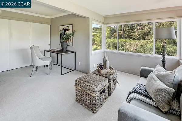 a living room with furniture and a large window