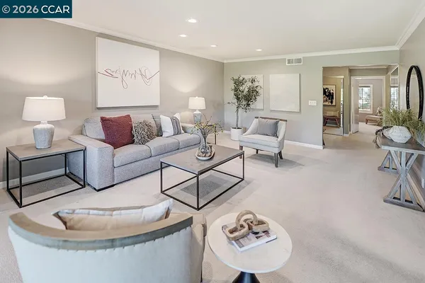 a view of a livingroom with a furniture and a flat screen tv