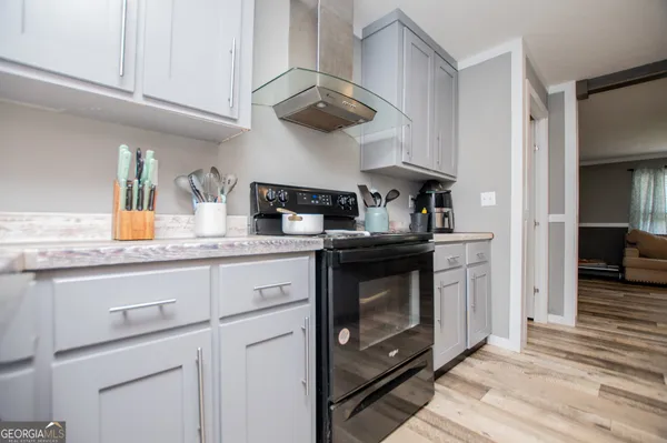 a kitchen with stainless steel appliances granite countertop a stove and a sink