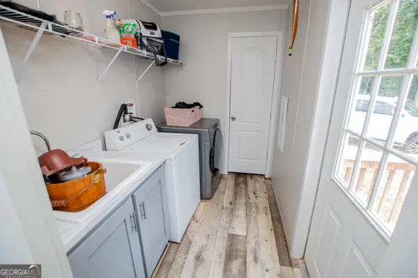 a utility room with a window dryer and washer