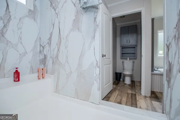 a bathroom with a bathtub and a shower