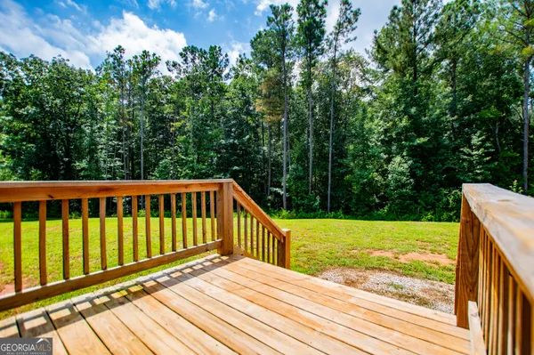 a view of a balcony with wooden floor