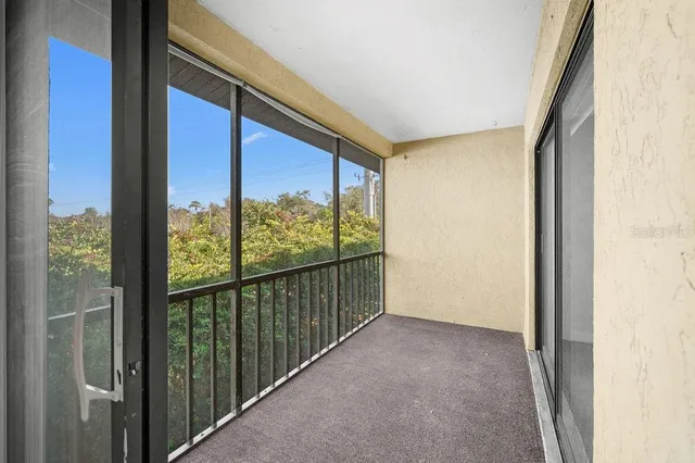 a view of hallway with furniture