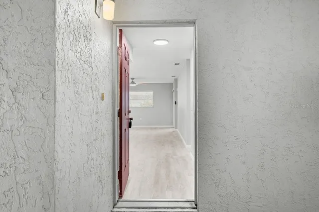 a view of a bathroom from a hallway