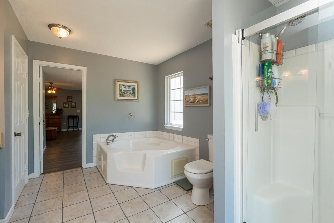 1712 New Vaughn Road Columbia, TN 38401 - Photo 14 of 23 Large master bathroom with jacuzzi tub and separate shower. Two linen closets. Double vanities