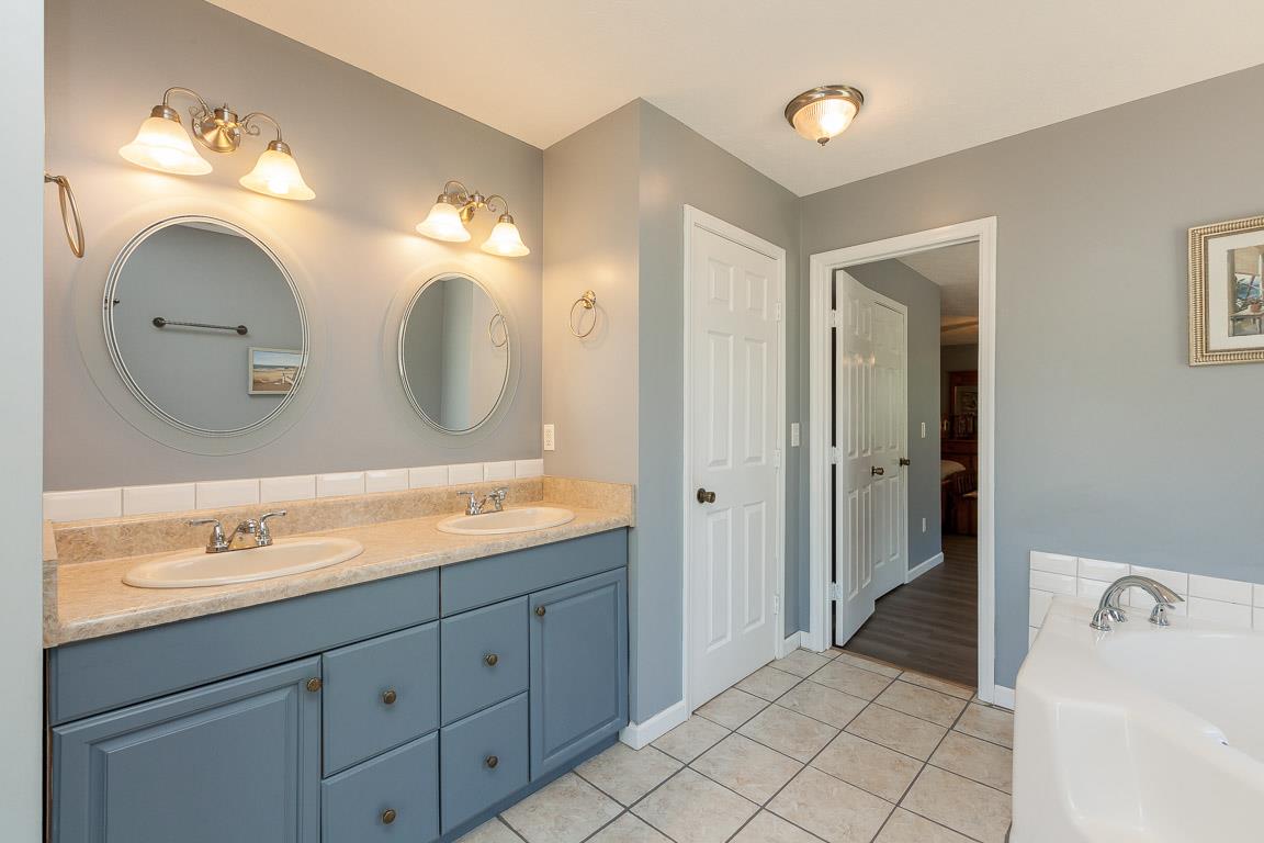 1712 New Vaughn Road Columbia, TN 38401 - Photo 15 of 23 Large master bathroom with jacuzzi tub and separate shower. Two linen closets. Double vanities
