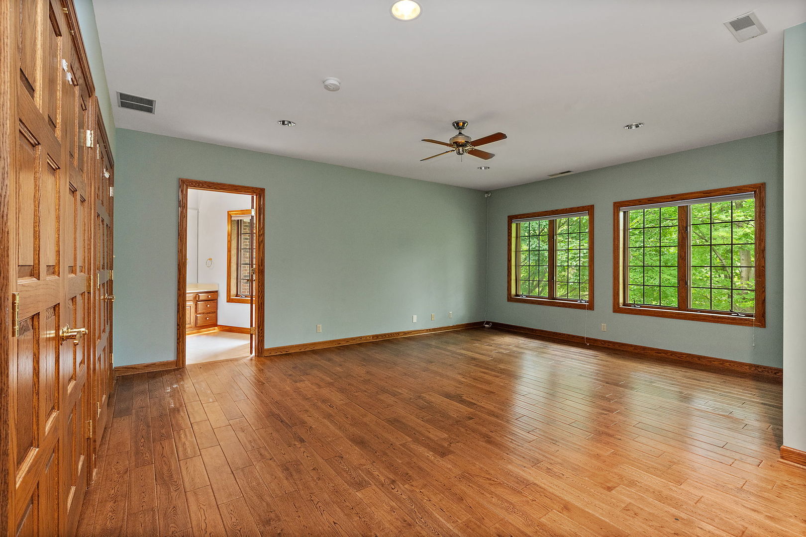 345 Bethany Road DeKalb, IL 60115 - Photo 27 of 71 a view of an empty room with wooden floor and a window