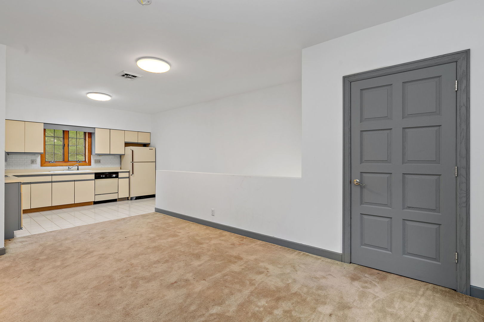 345 Bethany Road DeKalb, IL 60115 - Photo 33 of 71 a view of a kitchen with refrigerator and cabinet