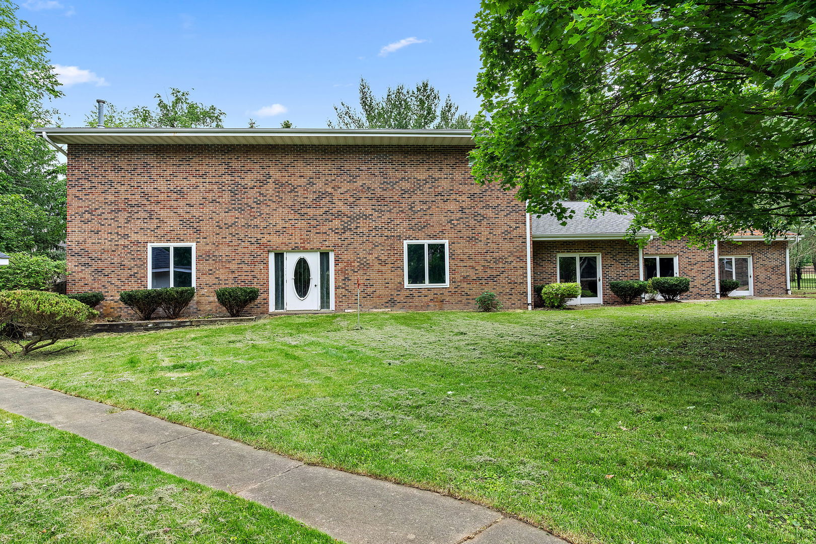 345 Bethany Road DeKalb, IL 60115 - Photo 41 of 71 a front view of a house with a garden