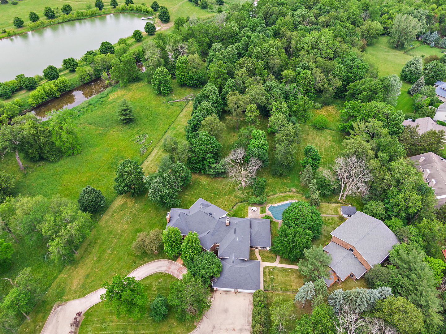 345 Bethany Road DeKalb, IL 60115 - Photo 59 of 71 an aerial view of residential house with outdoor space and lake view