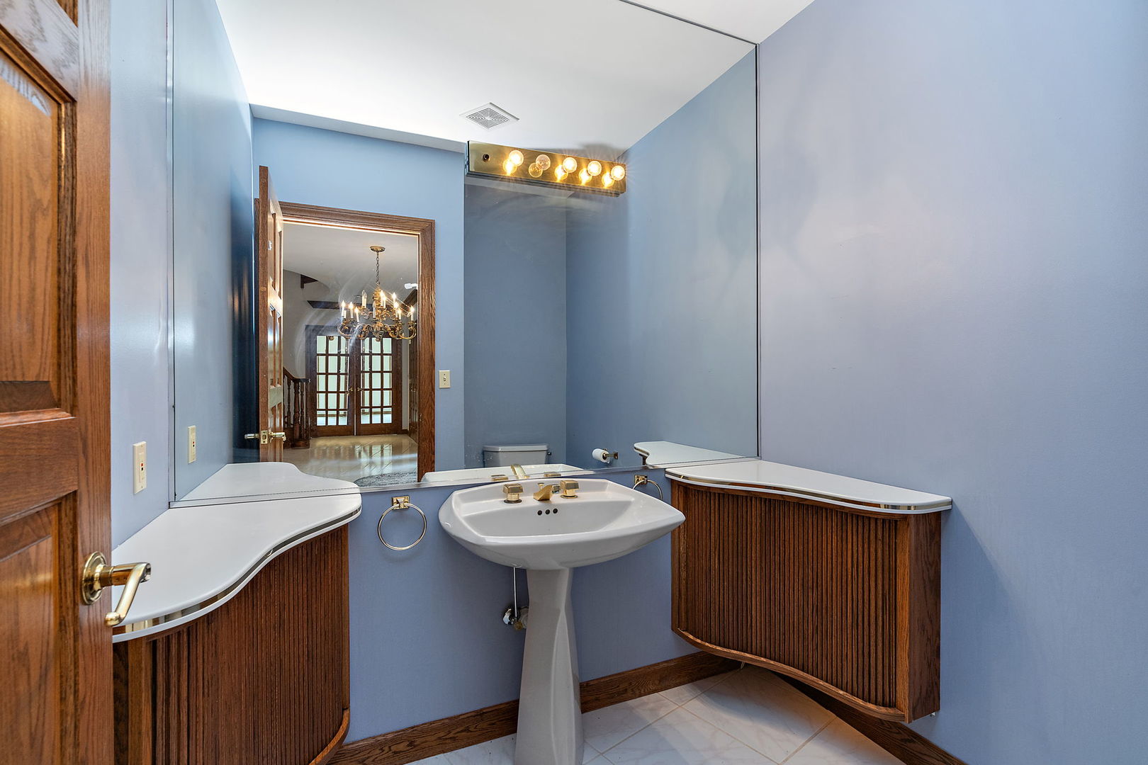 345 Bethany Road DeKalb, IL 60115 - Photo 6 of 71 a bathroom with a sink a mirror and a toilet
