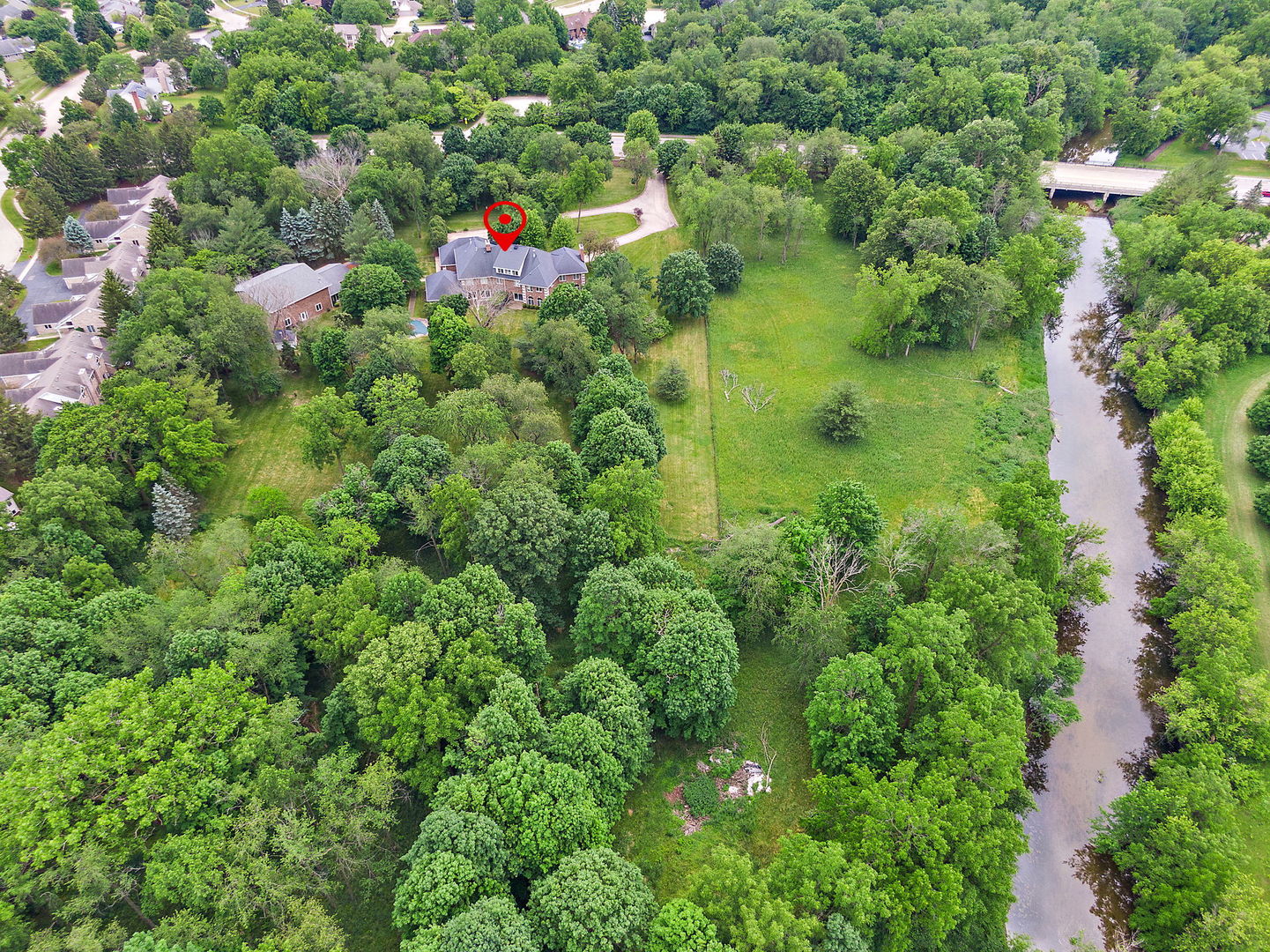 345 Bethany Road DeKalb, IL 60115 - Photo 66 of 71 an aerial view of residential houses with outdoor space and trees all around