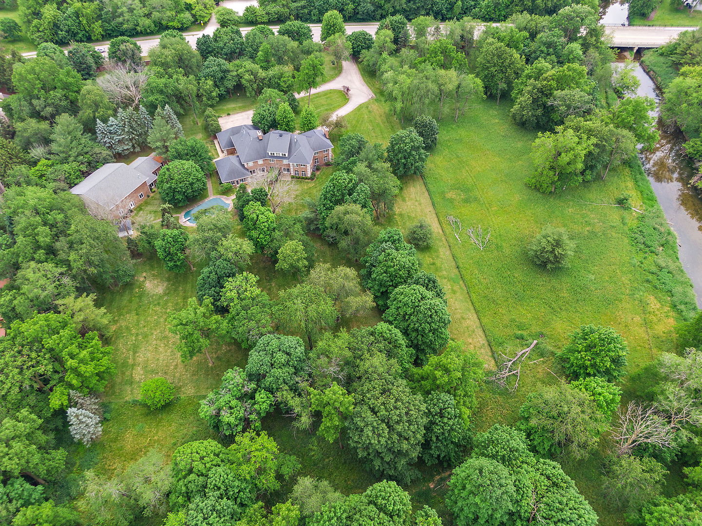 345 Bethany Road DeKalb, IL 60115 - Photo 67 of 71 an aerial view of residential house with outdoor space and trees all around