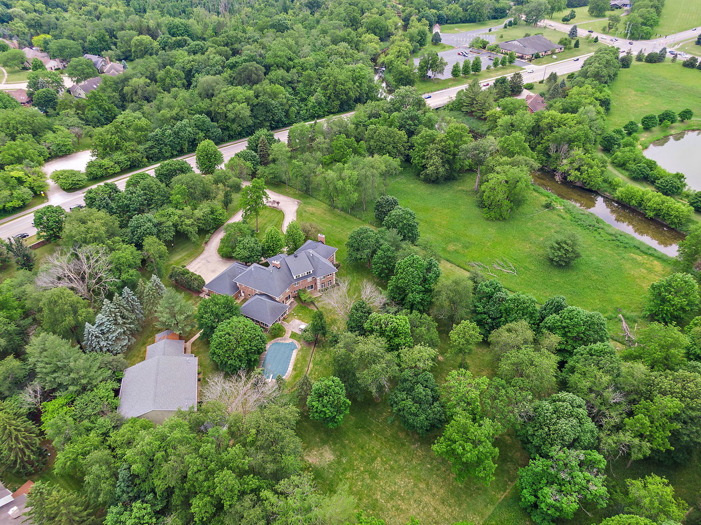 345 Bethany Road DeKalb, IL 60115 - Photo 68 of 71 an aerial view of residential house with outdoor space and trees all around