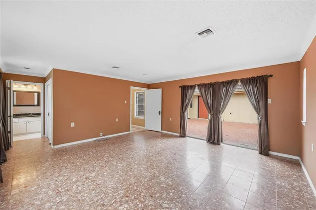 a bathroom with a shower and a glass door
