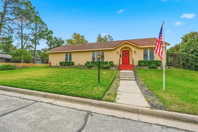 a front view of a house with yard