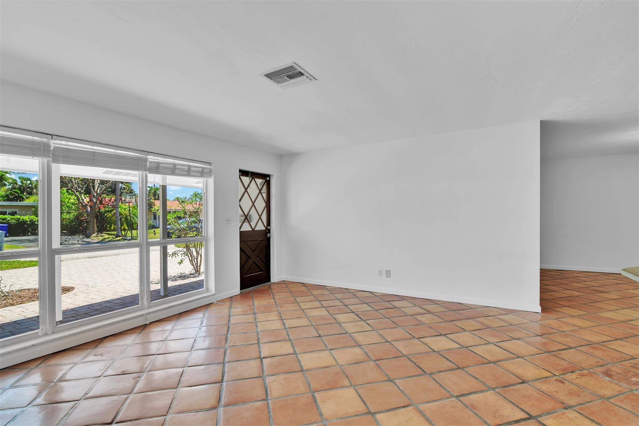 341 Southeast 8th Street Pompano Beach, FL 33060 - Photo 14 of 56 a view of an empty room and window