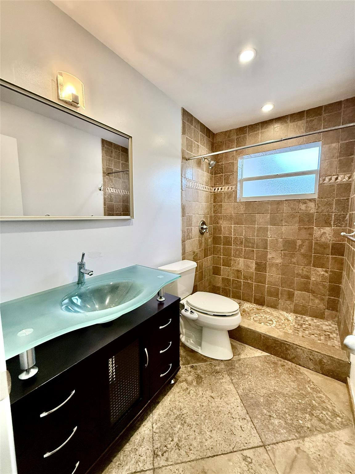 341 Southeast 8th Street Pompano Beach, FL 33060 - Photo 23 of 56 a bathroom with a sink toilet and shower