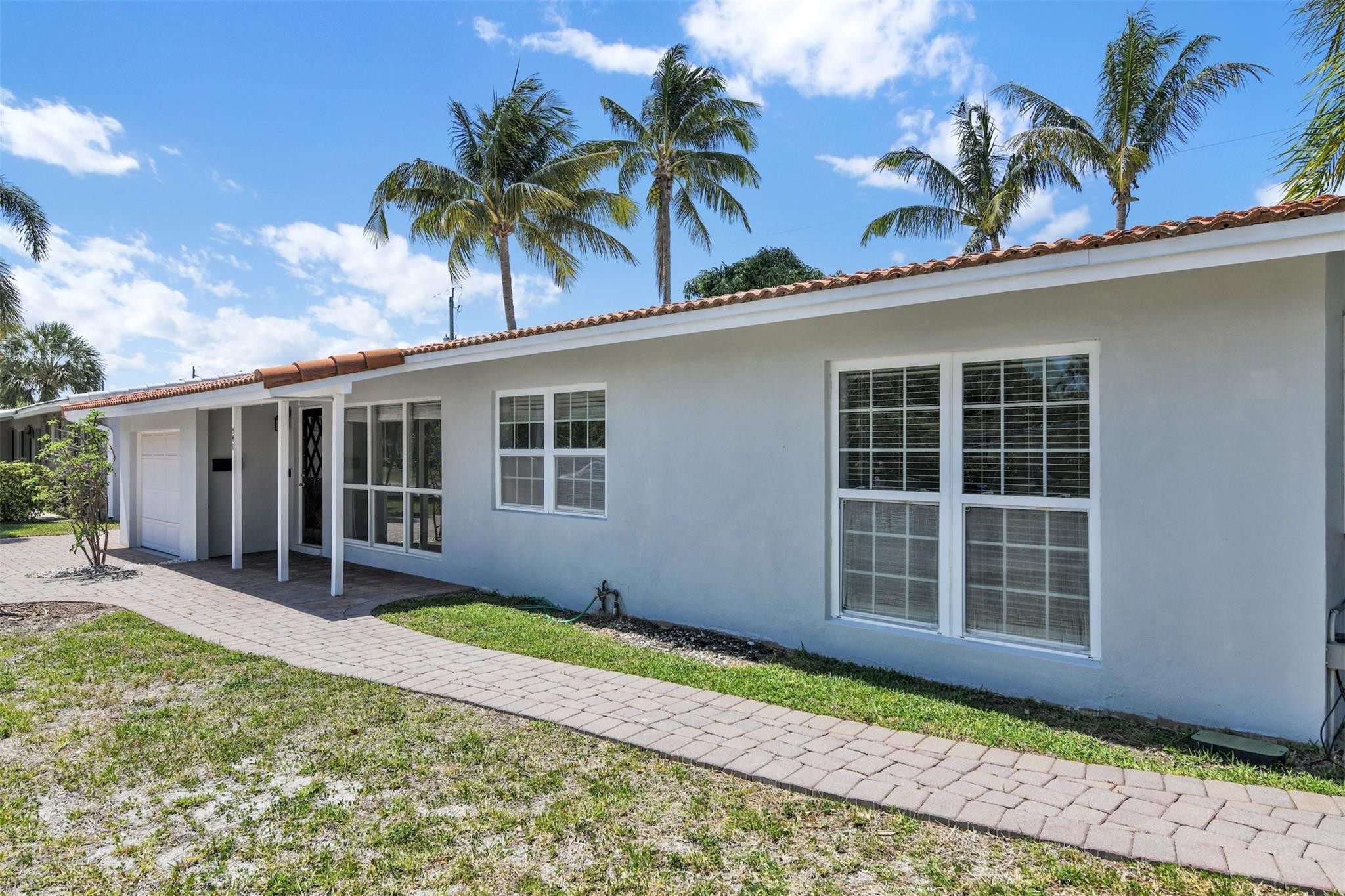 341 Southeast 8th Street Pompano Beach, FL 33060 - Photo 34 of 56 a house with front yard