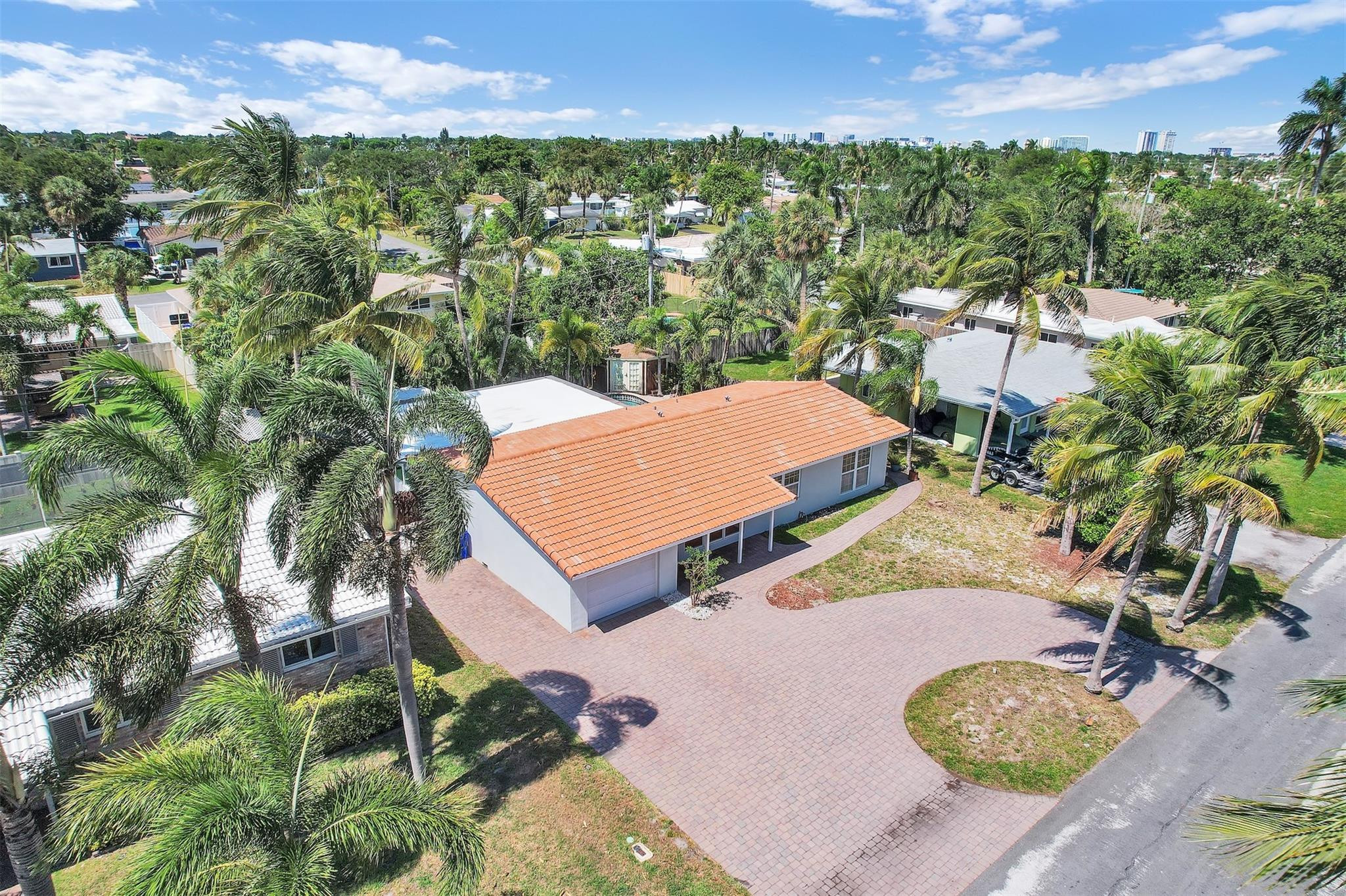 341 Southeast 8th Street Pompano Beach, FL 33060 - Photo 40 of 56 an aerial view of residential houses with outdoor space and trees