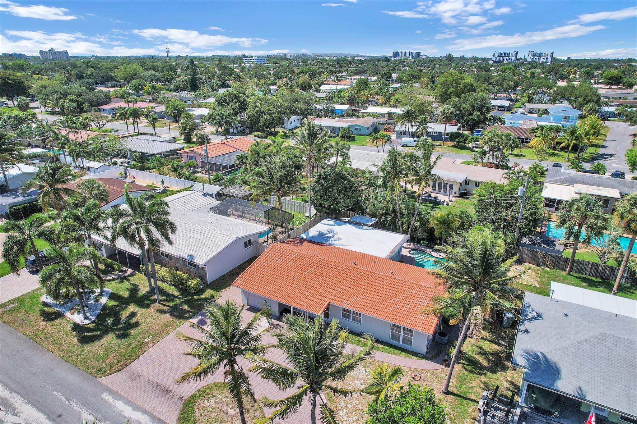 341 Southeast 8th Street Pompano Beach, FL 33060 - Photo 41 of 56 an aerial view of residential houses with outdoor space and trees