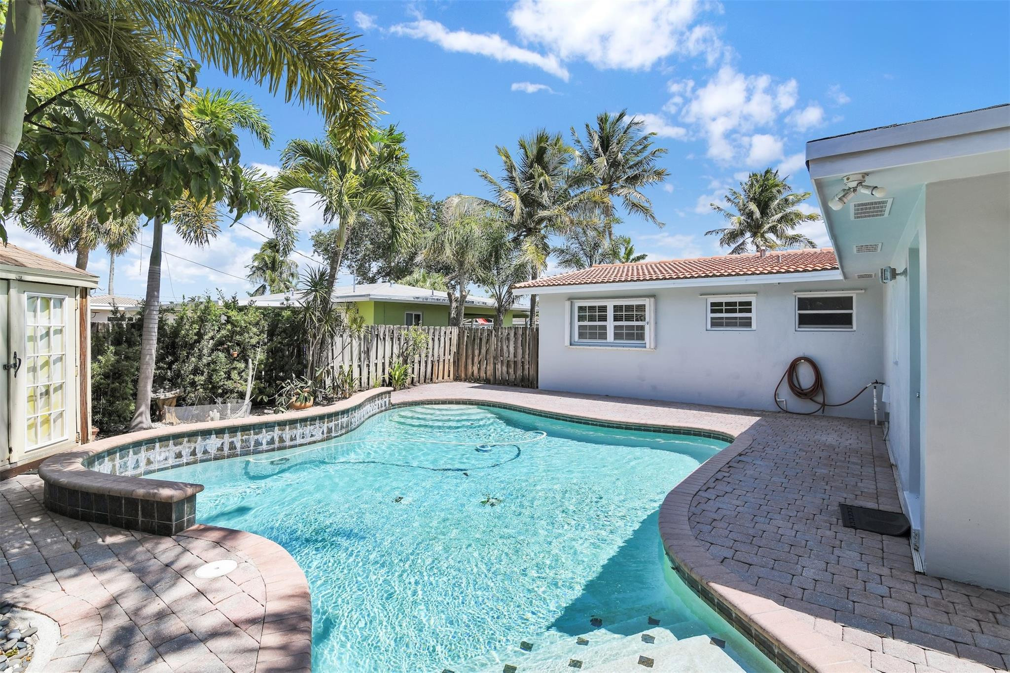 341 Southeast 8th Street Pompano Beach, FL 33060 - Photo 52 of 56 a view of a house with backyard and a tree