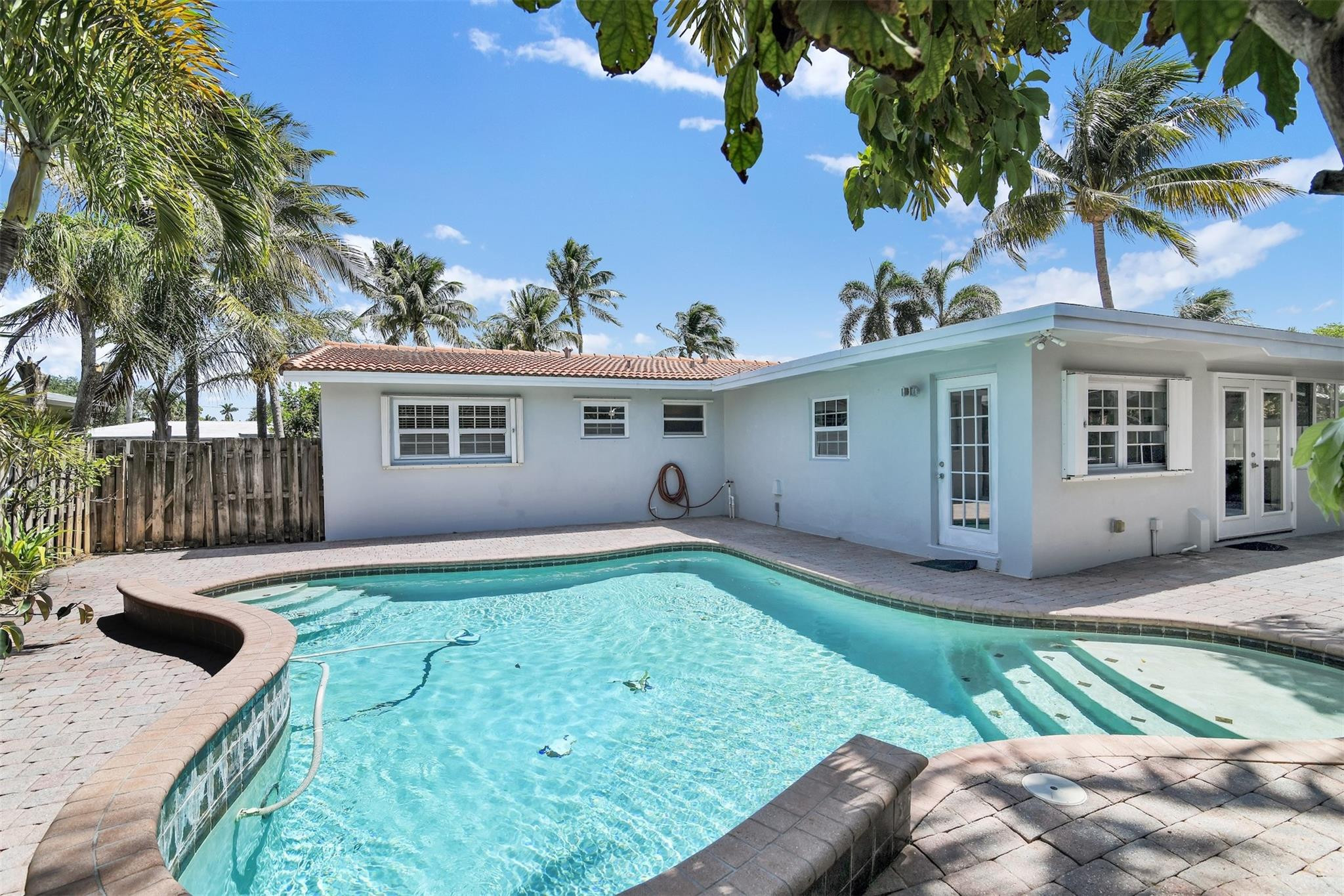 341 Southeast 8th Street Pompano Beach, FL 33060 - Photo 53 of 56 a view of a house with backyard and a tree