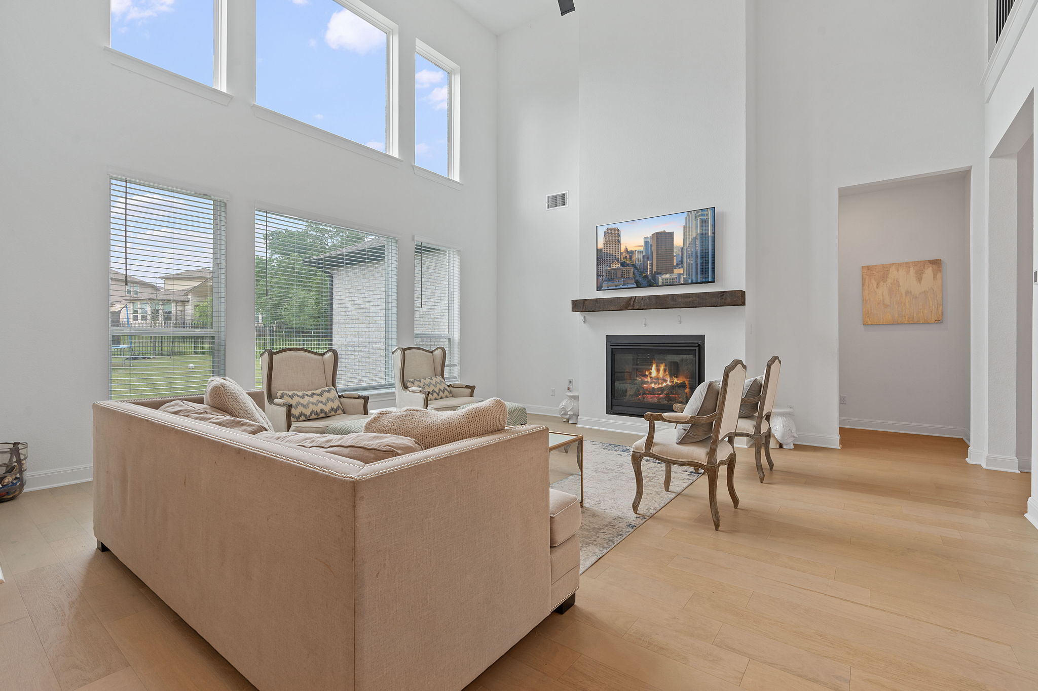 309 Pear Tree Lane Austin, TX 78737 - Photo 6 of 39 a living room with furniture a fireplace and a table