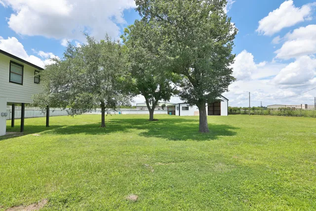 a view of a tree in front of a house