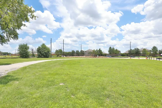 a view of a lake with houses in the back
