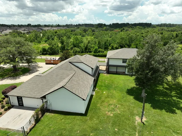 an aerial view of a house having yard