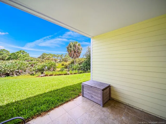 a view of a two chair in the garden