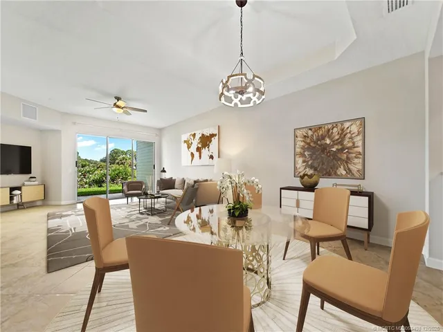 a view of a dining room with furniture window and outside view