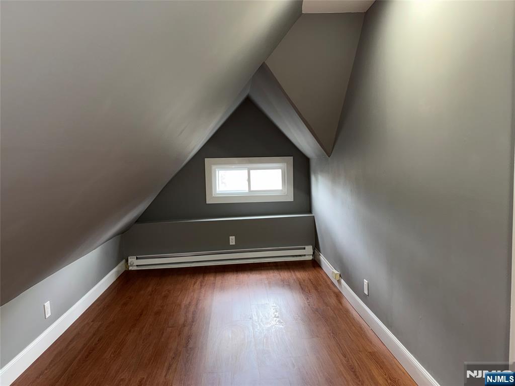 178 Berry Street Hackensack, NJ 07601 - Photo 17 of 22 a room with wooden floor and a window