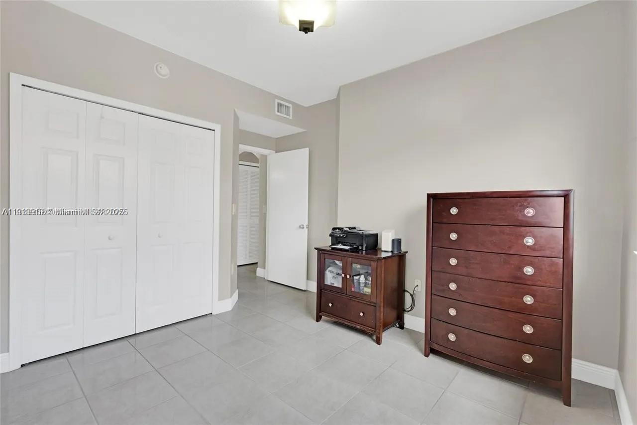 8422 Northwest 140th Terrace, Unit 3608 Miami Lakes, FL 33016 - Photo 17 of 23 a view of room with cabinet and cabinet