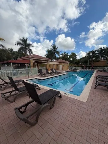 a view of outdoor space with swimming pool and patio