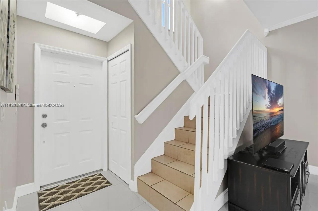 8422 Northwest 140th Terrace, Unit 3608 Miami Lakes, FL 33016 - Photo 8 of 23 a view of entryway and hall with wooden floor