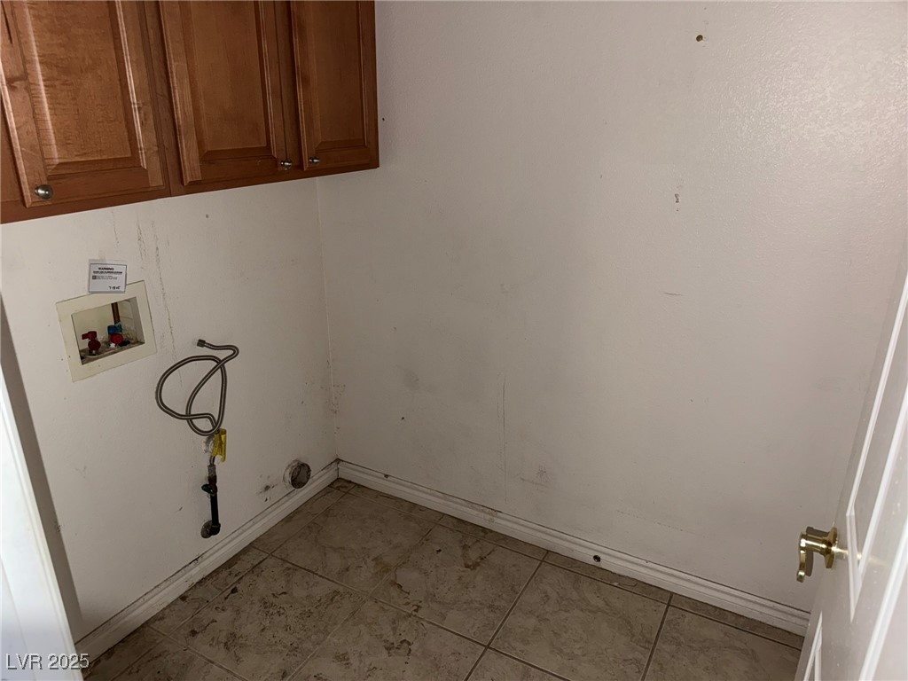 985 Prestwick Street Las Vegas, NV 89145 - Photo 15 of 27 Laundry room with hookup for a washing machine and cabinet space