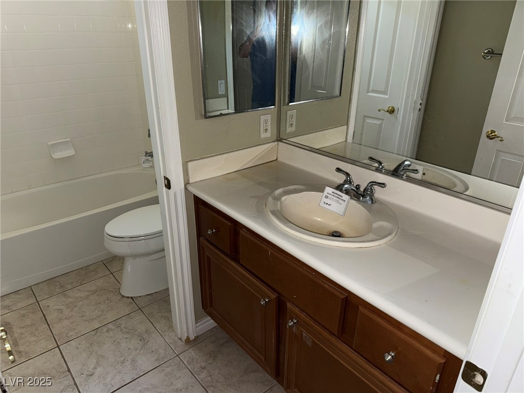 985 Prestwick Street Las Vegas, NV 89145 - Photo 17 of 27 Bathroom with vanity, tile patterned flooring, and shower / tub combination