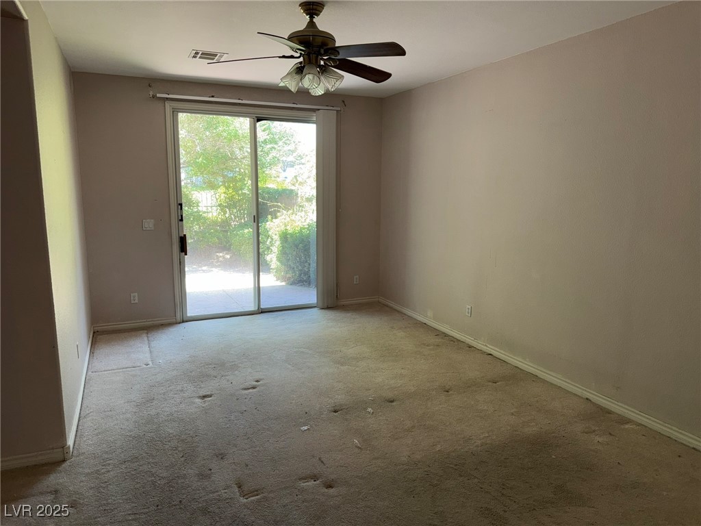 985 Prestwick Street Las Vegas, NV 89145 - Photo 18 of 27 Carpeted spare room with a ceiling fan and baseboards
