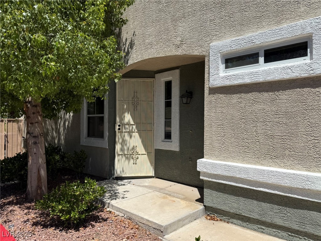 985 Prestwick Street Las Vegas, NV 89145 - Photo 6 of 27 Property entrance with stucco siding