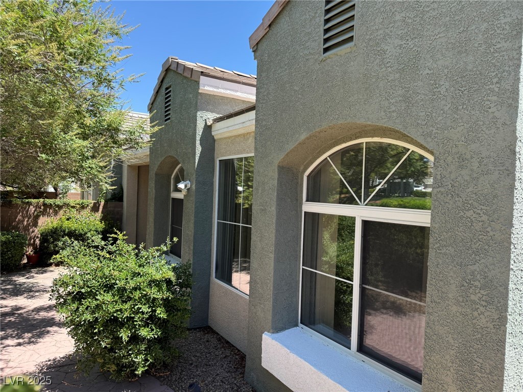 985 Prestwick Street Las Vegas, NV 89145 - Photo 10 of 27 View of property exterior with stucco siding