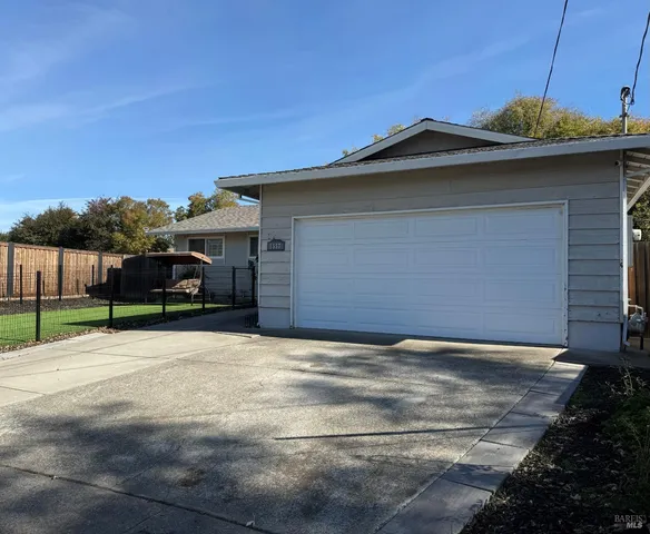 a view of a car in front of a house