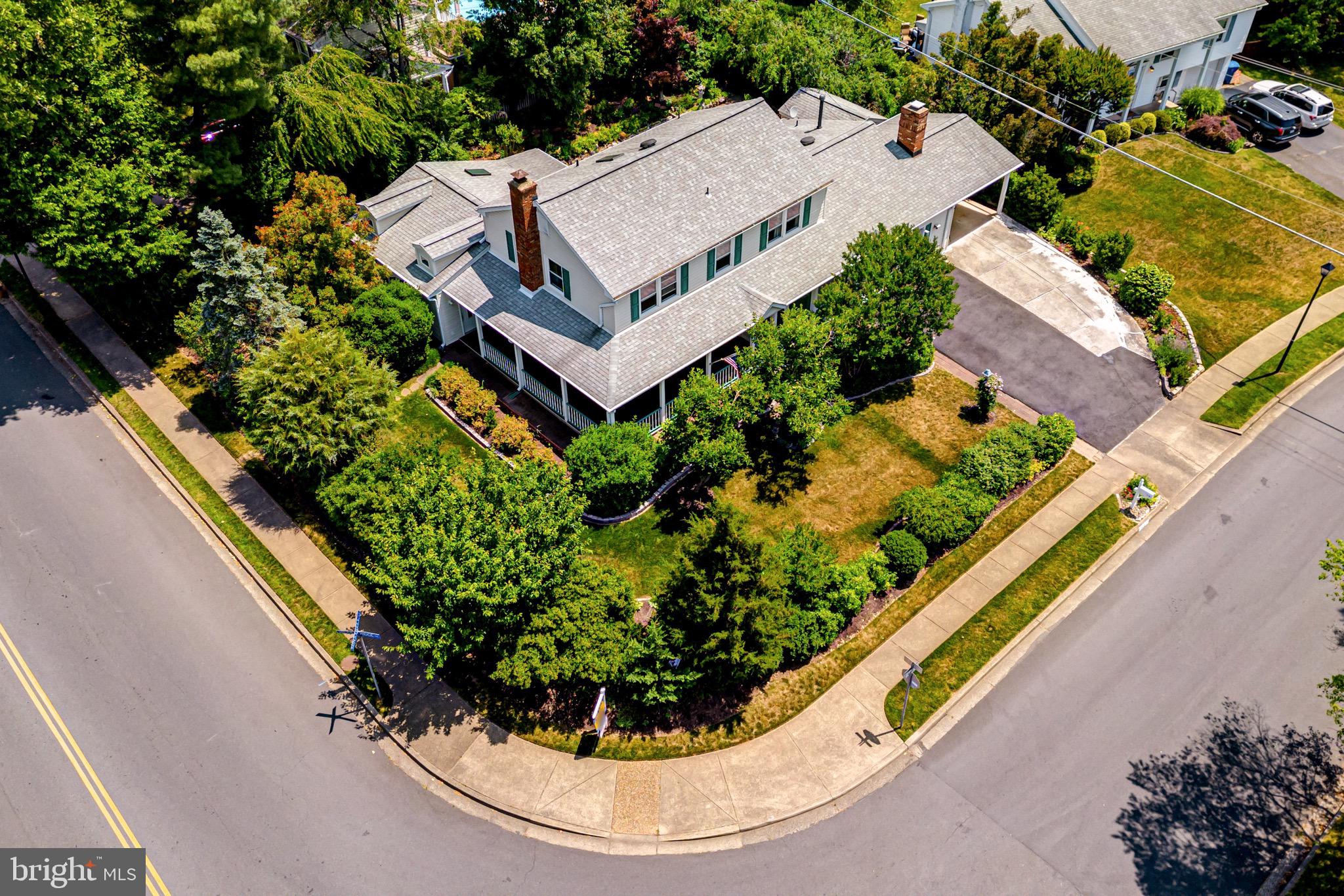 an aerial view of a house with a garden and plants