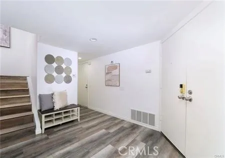 a room with furniture and wooden floor